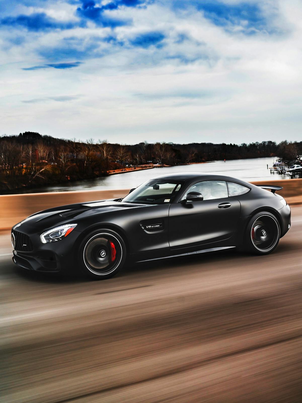 black mercedes amg gt on road