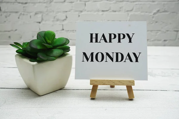 happy monday text wooden easel