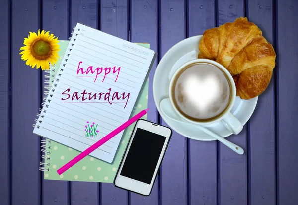 happy saturday on blank notebook