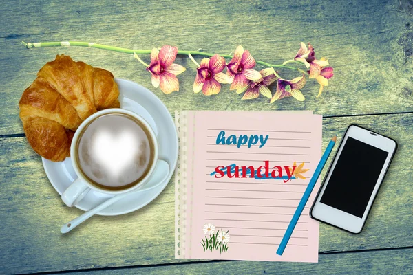 happy sunday on blank notebook